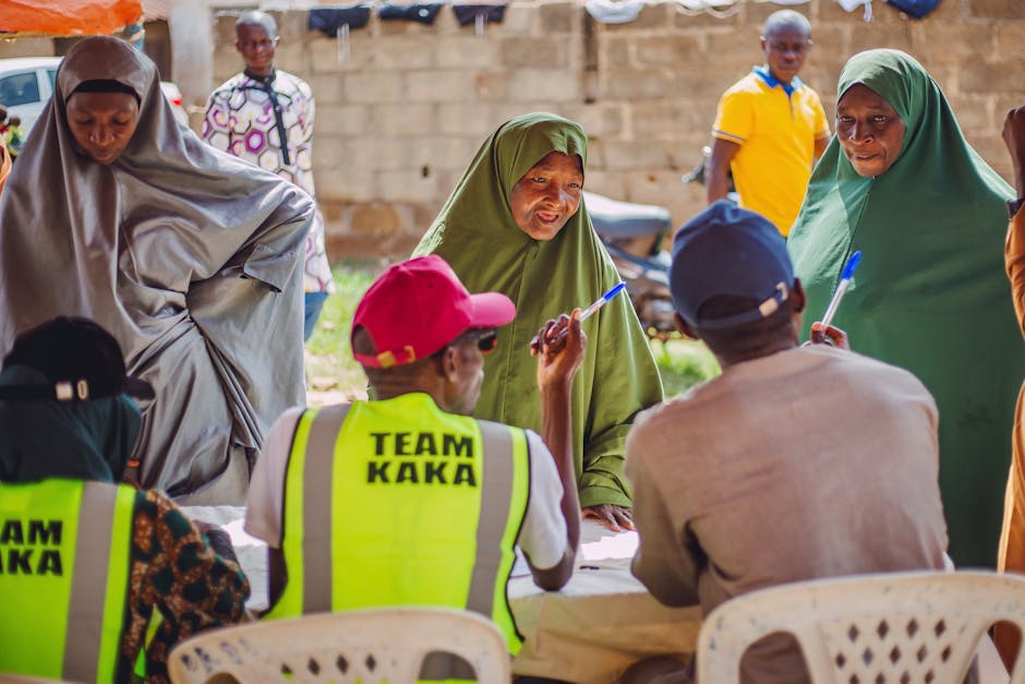 A vibrant community meeting in Kaduna, Nigeria, highlighting engagement and collaboration.